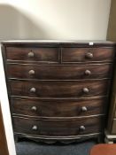 A Victorian mahogany bow-fronted chest of six drawers.