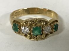 An 18ct gold emerald and diamond ring, size O, 4.1g.