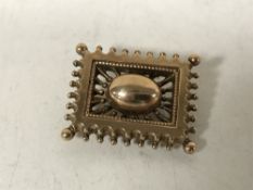 A brooch stamped 9ct, 3.