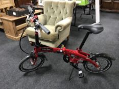A Dahon Curve 13 16 inch folding bike