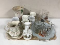 A tray of Maling jug, commemorative mugs and glass ware, champagne glasses,