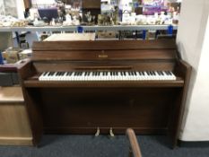 A mahogany cased mini piano by Eavestaff