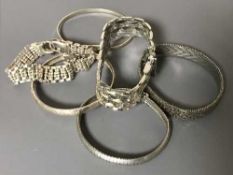 Seven silver bangles and bracelets (7)