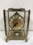 A brass cased anniversary clock