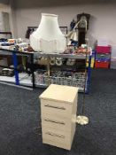 A contemporary beech three drawer bedside chest,