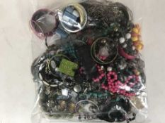 Three bags containing a large quantity of costume jewellery