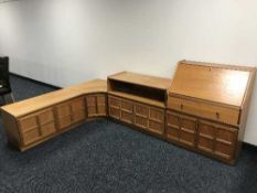 A Parker Knoll teak writing bureau and a three piece Parker Knoll teak corner unit