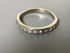 An 18ct white gold diamond half eternity ring, approximately 0.75ct.