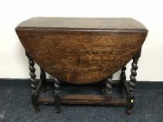 An oak barley twist gate leg table