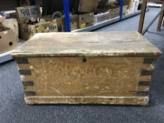 An antique pine blanket box with metal mounts