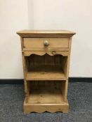 A pine bedside cabinet fitted a drawer