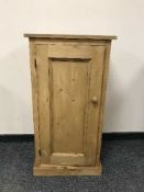 A pine single door cupboard