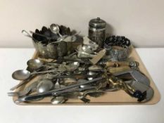 A quantity of assorted plated flatware, three-piece carving set, plated gravy boat,