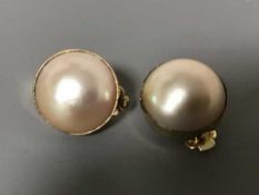 A pair of large mabe pearl earrings set in 18ct gold