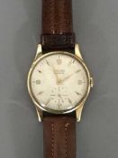A 9ct Rolex Precision Gentleman's wrist watch on brown stitched leather strap