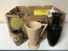A box containing assorted china including Royal Doulton vase, eastern resin vase, Wedgwood,