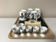 A tray containing a boxed Maling plate, four Newcastle Upon Tyne NUFC tankards, egg cups,