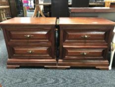 A pair of mahogany two-drawer bedside chests