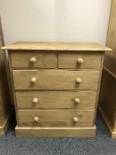 A pine five drawer chest