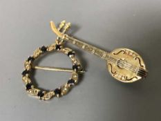 Two gold brooches set with diamonds and sapphires,