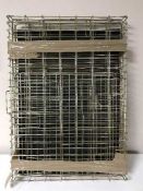 A folding metal dog cage