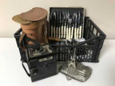 A basket containing a set of cased binoculars, a coronet camera, Conway camera,