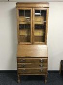 An oak leaded glass door bureau bookcase