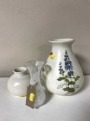 Two Poole pottery vases together with a Caithness vase