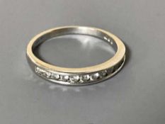 An 18ct gold diamond half eternity ring