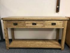 A light oak three-drawer dresser