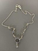 A silver and blue moonstone set necklace
