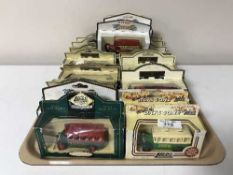Twenty three boxed Days Gone By die cast vehicles and a Days Gone By wall mounted display case of