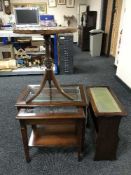 A nest of two mahogany glass top tables together with a mahogany leather topped magazine table and