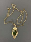 18 ct owl pendant set with emerald and chain. 12.