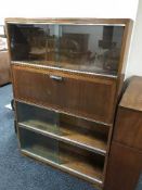 A mahogany four tier stacking bookcase