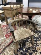 An antique stick-back armchair