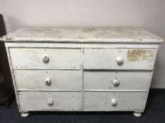 An antique painted pine six drawer chest