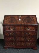 An inlaid mahogany writing bureau on bracket feet