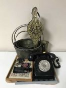 A tray of three brass jam pans, brass bellows, bakelite telephones,