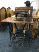 A Singer treadle sewing machine in mahogany table