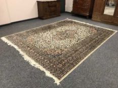 A large Persian Kashan carpet with cream field
