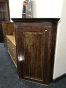 A Victorian inlaid mahogany hanging corner cabinet