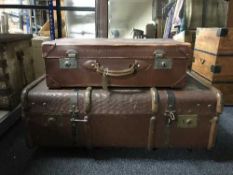 A vintage wooden bound cabin trunk named to Miss E.