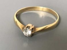 An 18ct gold diamond solitaire ring, 0.