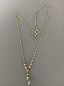 A 9ct gold seed pearl set pendant