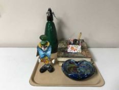 A tray containing a vintage soda siphon,