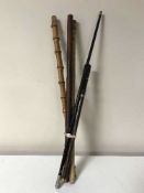 Four swagger sticks and a small rosewood sword stick
