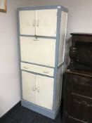 A painted mid 20th century kitchen cabinet