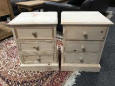 A pair of three drawer pine chests