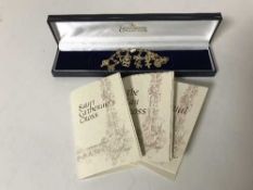 A boxed Goldroom Collection 9ct gold charm bracelet